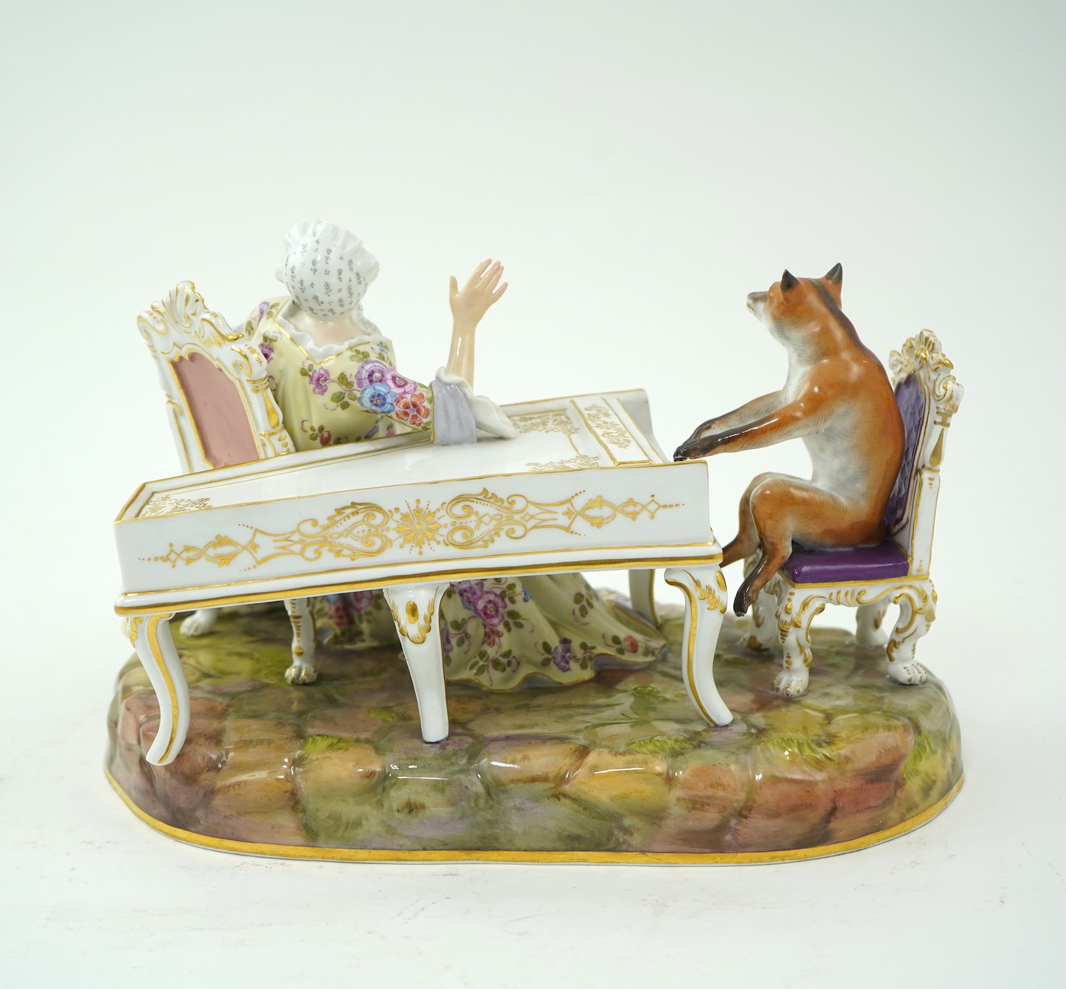A Meissen group of a fox at the piano and a lady listening, after J. J. Kandler, late 19th century